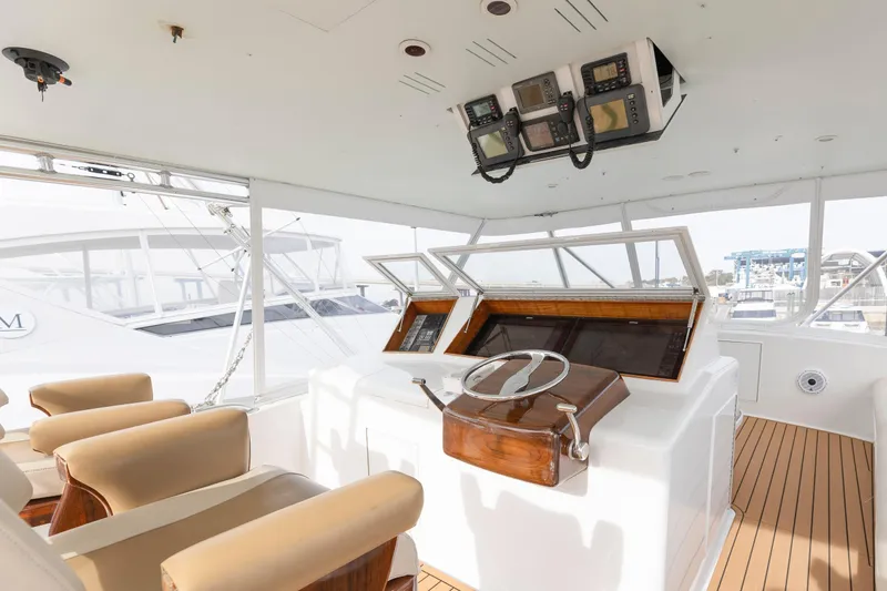 Slide: The Image of 2005 Weaver 61 yacht cruising on open water, clear sky background. - 3