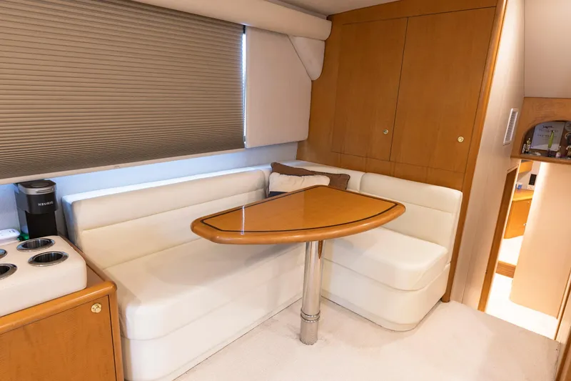 Slide: The Image of Luxurious Weaver 61 yacht bedroom, 2005 model, featuring cozy bed and modern lighting. - 33