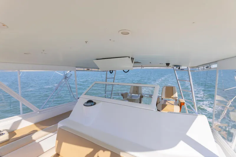 Slide: The Image of Spacious helm of 2005 Weaver 61 yacht with ocean view and seating. - 44