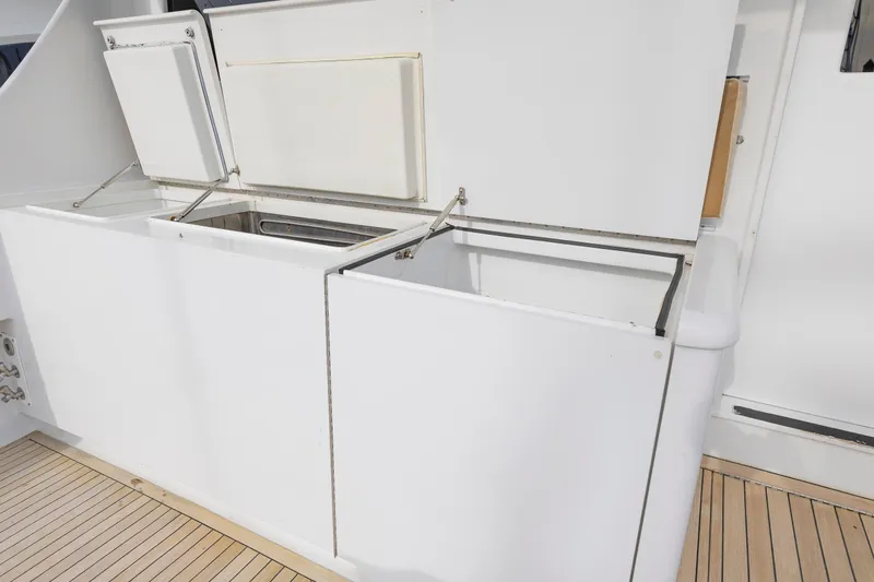 Slide: The Image of Open storage compartments on a 2005 Weaver 61 yacht deck. - 52