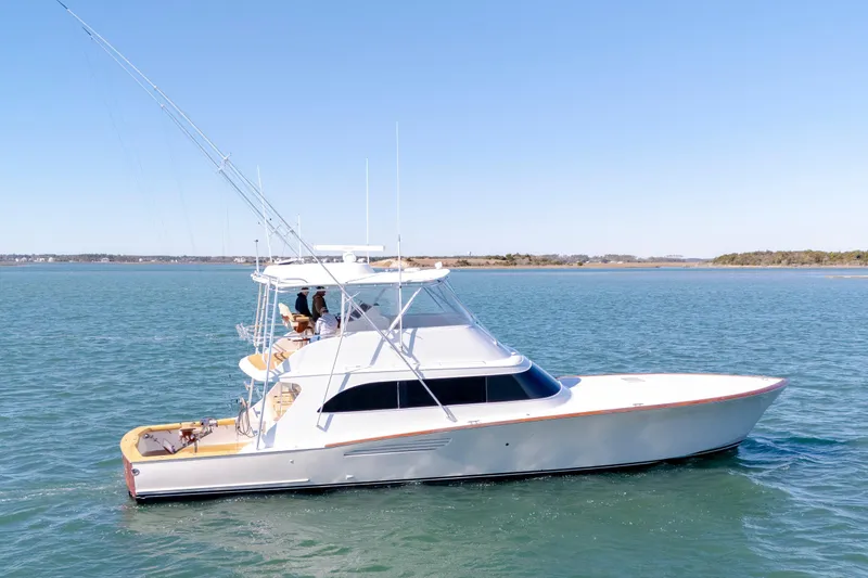 Slide: The Image of 2005 Weaver 61 yacht cruising on calm blue waters under clear skies. - 53