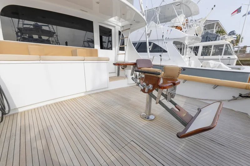 Slide: The Image of Luxury Weaver 61 yacht deck with fishing chair, 2005 model, docked at marina. - 55