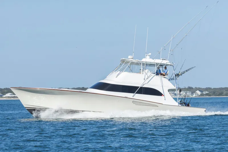 Slide: The Image of Sportfishing yacht Weaver 61, 2005 model, cruising on open water. - 61