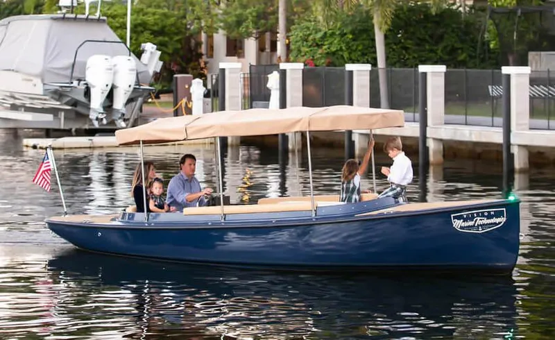 The Image of 2023 Vision Marine Technologies Fantail 217 boat cruising with passengers on a calm waterway. - 0