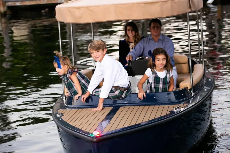 Slide: The Image of Family enjoying a ride on the 2023 Vision Marine Technologies Fantail 217 boat. - 1