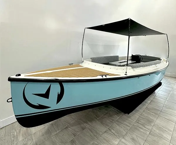The Image of 2023 Vision Marine Technologies Fantail 217 boat with canopy, displayed indoors. - 0