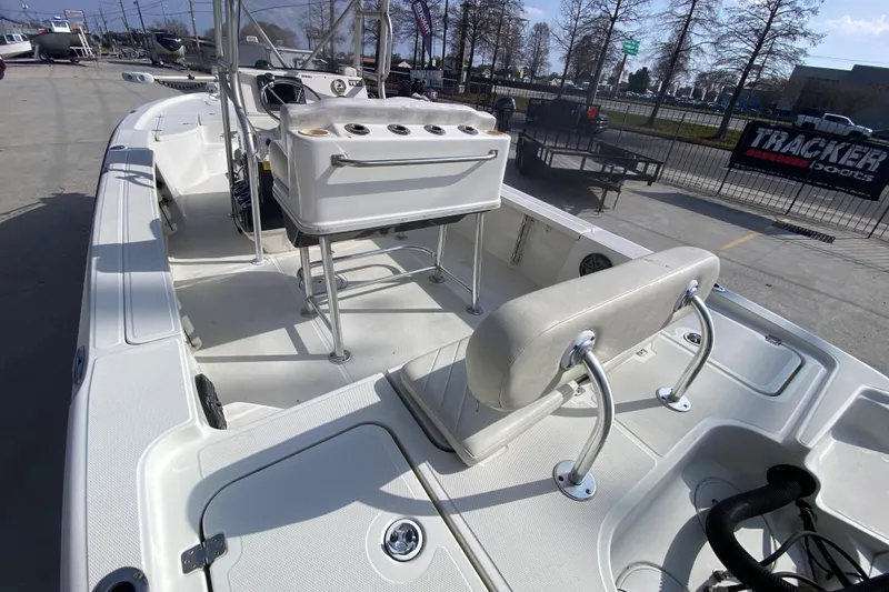 Slide: The Image of 2007 Triton 240 LTS boat interior with seating and storage compartments. - 16