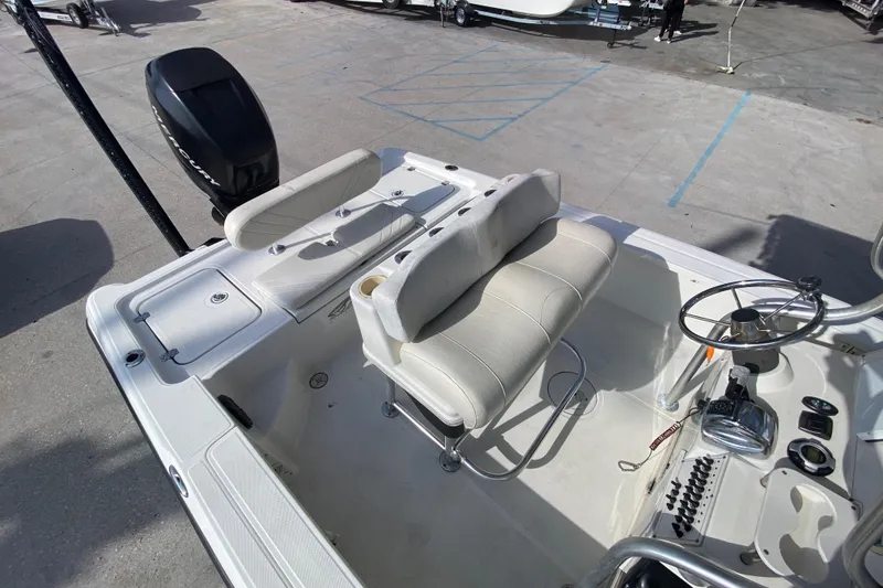 Slide: The Image of 2007 Triton 240 LTS boat interior with seating and steering wheel. - 18