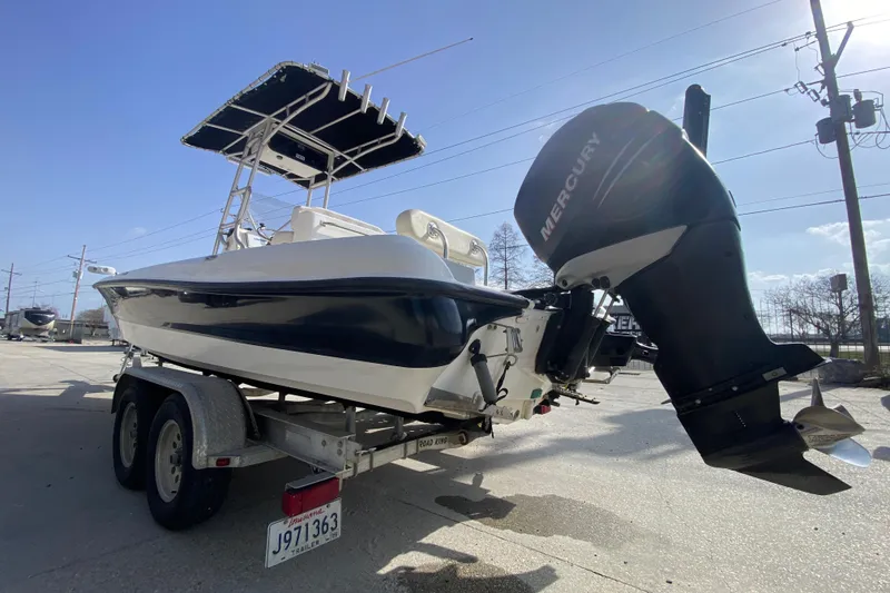 Slide: The Image of 2007 Triton 240 LTS boat on trailer with Mercury outboard motor. - 5