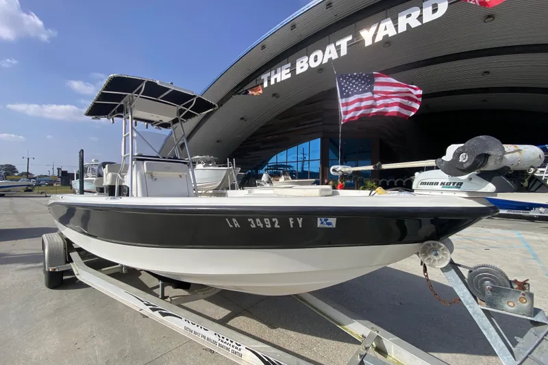 Slide: The Image of 2007 Triton 240 LTS boat on trailer at The Boat Yard, American flag displayed. - 9