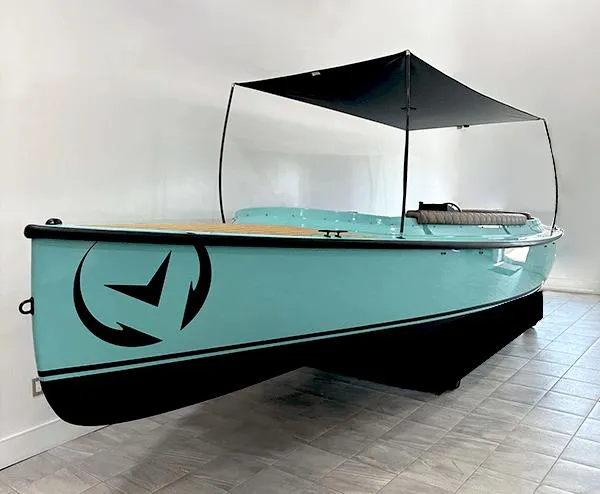 The Image of 2023 Vision Marine Technologies Fantail 217 boat with canopy, displayed indoors. - 0