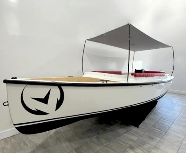 The Image of 2023 Vision Marine Technologies Fantail 217 boat with canopy, displayed indoors. - 0