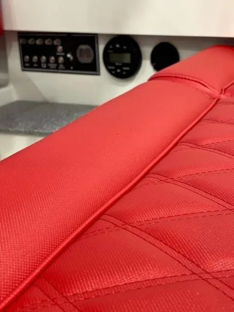 Slide: The Image of Red interior of 2023 Vision Marine Technologies Fantail 217 boat with control panel. - 4