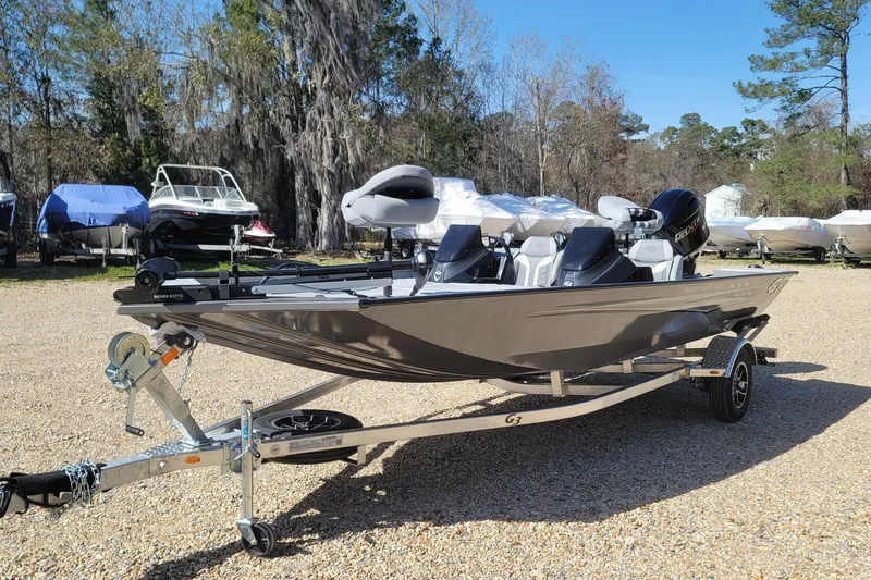 The Image of 2026 G3 Sportsman 1810 SE boat on trailer, parked outdoors on gravel. - 0