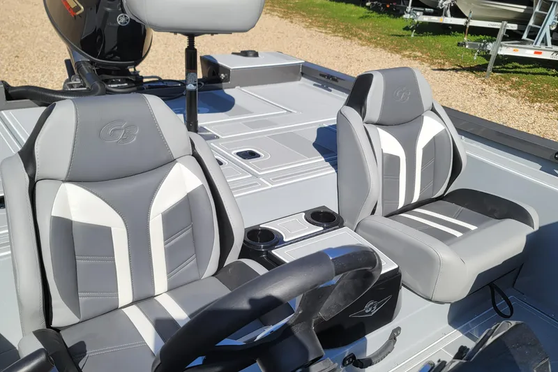 Slide: The Image of 2026 G3 Sportsman 1810 SE boat interior with gray and white seating. - 10