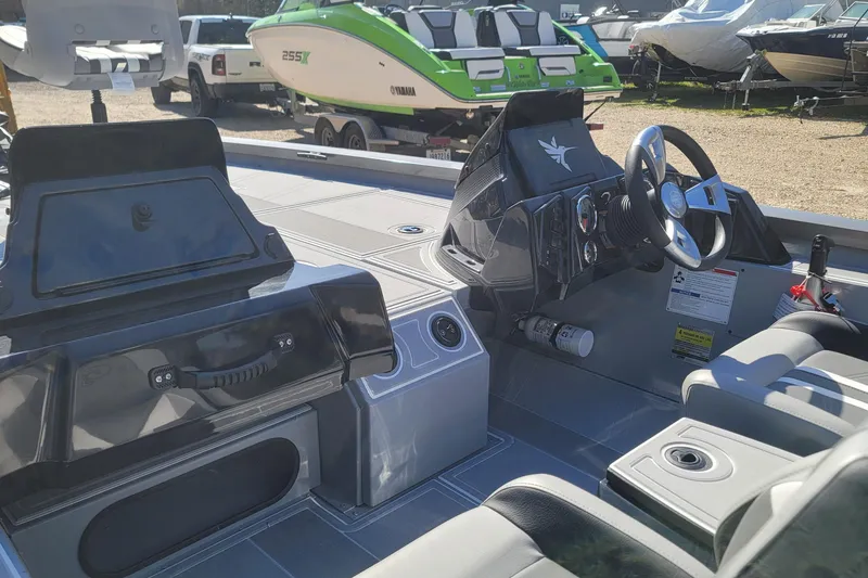 Slide: The Image of 2026 G3 Sportsman 1810 SE boat interior with steering console and seating. - 13