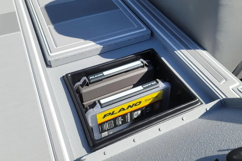 Slide: The Image of Storage compartment on 2026 G3 Sportsman 1810 SE boat with Plano tackle boxes. - 17