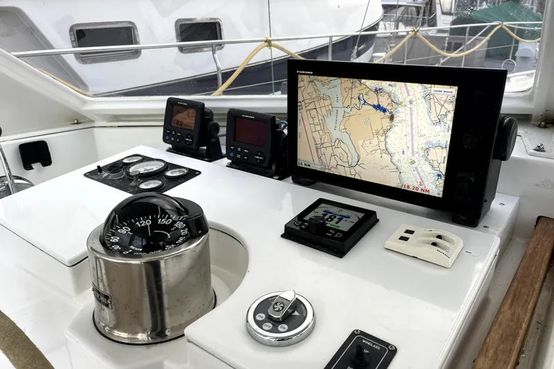 Slide: The Image of Cockpit of 1979 Amel Mango sailboat with navigation instruments and compass. - 19