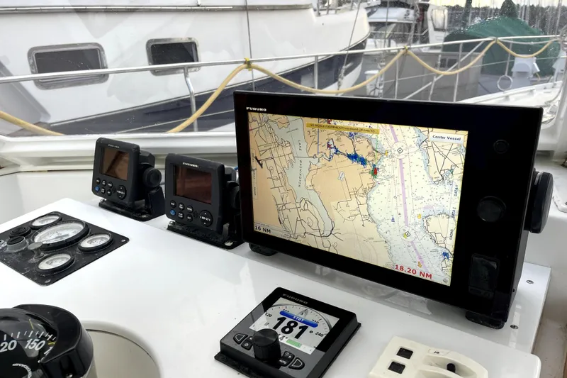 Slide: The Image of Navigation equipment on a 1979 Amel Mango sailboat, featuring a Furuno chart plotter. - 20