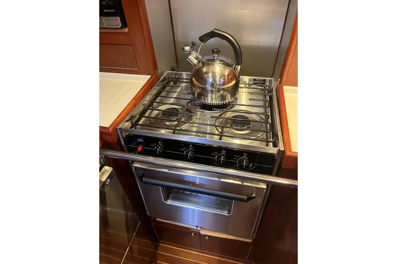 Slide: The Image of Stainless steel stove with kettle in 1979 Amel Mango yacht kitchen. - 35