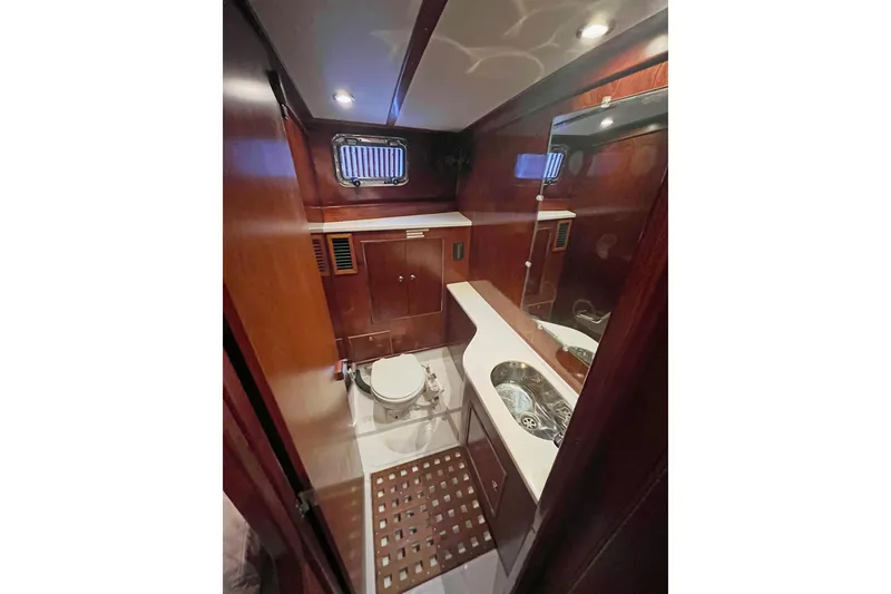 Slide: The Image of 1979 Amel Mango yacht bathroom with wooden cabinetry and modern fixtures. - 42