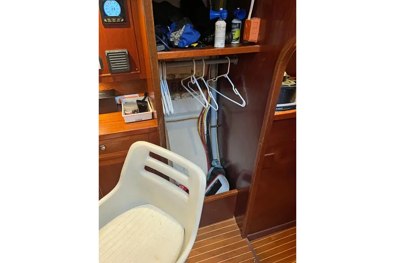 Slide: The Image of Interior of 1979 Amel Mango sailboat with storage and navigation equipment. - 46