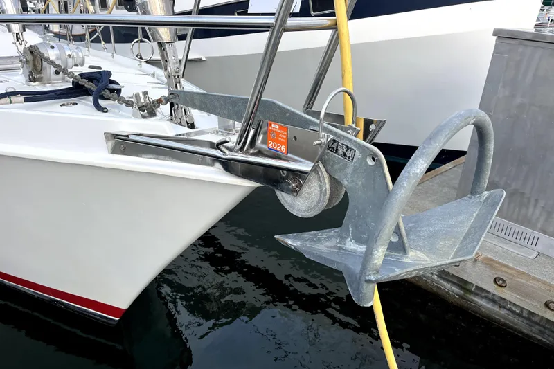 Slide: The Image of 1979 Amel Mango sailboat with anchor and mooring equipment at dock. - 5