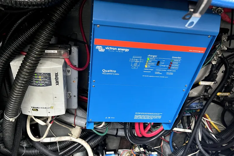 Slide: The Image of Electrical system with Victron Energy Quattro inverter and Xantrex TrueCharge2 in a 1979 Amel Mango. - 54