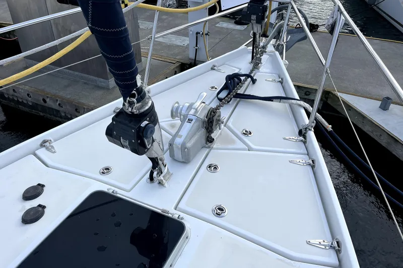Slide: The Image of Deck of 1979 Amel Mango sailboat with winch and rigging at dock. - 6