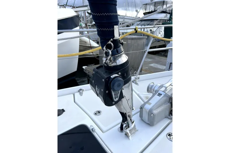 Slide: The Image of Close-up of a 1979 Amel Mango sailboat's deck equipment at a marina. - 8