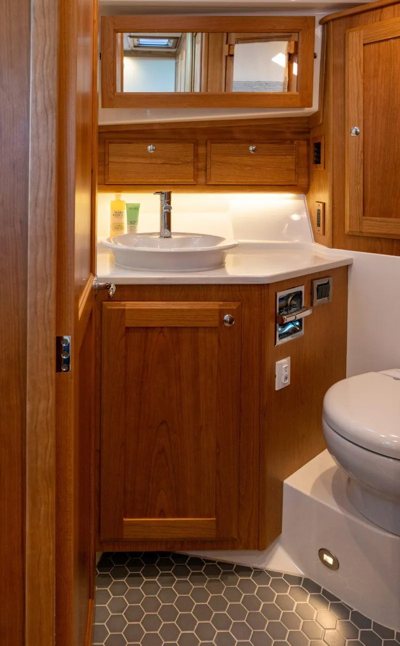 Slide: The Image of Luxurious bathroom in 2026 Sabre 43 Salon Express yacht with wooden cabinetry and modern fixtures. - 30