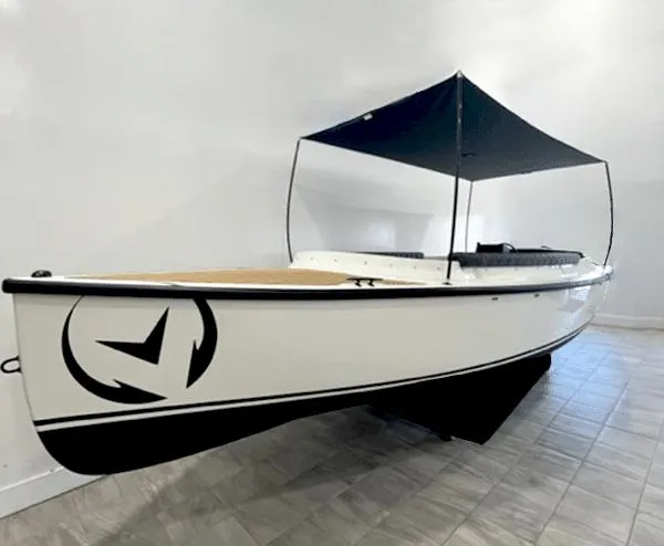 The Image of 2023 Vision Marine Technologies Fantail 217 boat with canopy, displayed indoors. - 0