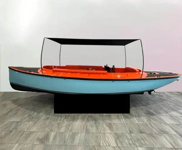 The Image of 2023 Vision Marine Technologies Fantail 217 boat with orange and blue design, displayed indoors. - 0