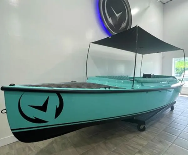 The Image of 2023 Vision Marine Technologies Fantail 217 boat with canopy, displayed indoors. - 0