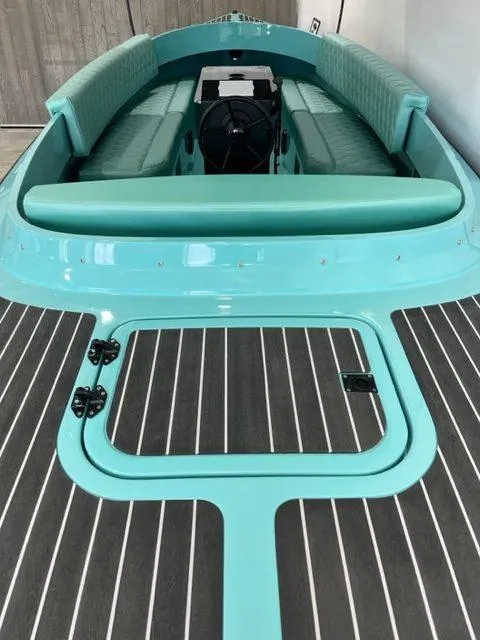 Slide: The Image of 2023 Vision Marine Technologies Fantail 217 boat with turquoise seating and sleek design. - 7