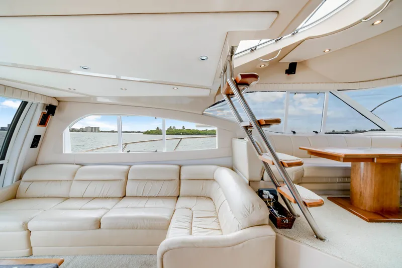 Slide: The Image of Luxurious interior of 2001 Cruisers Yachts 5000 Sedan Sport with leather seating and wooden accents. - 36