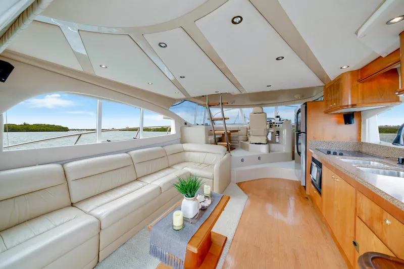 Slide: The Image of Luxurious interior of 2001 Cruisers Yachts 5000 Sedan Sport with leather seating and modern kitchen. - 40