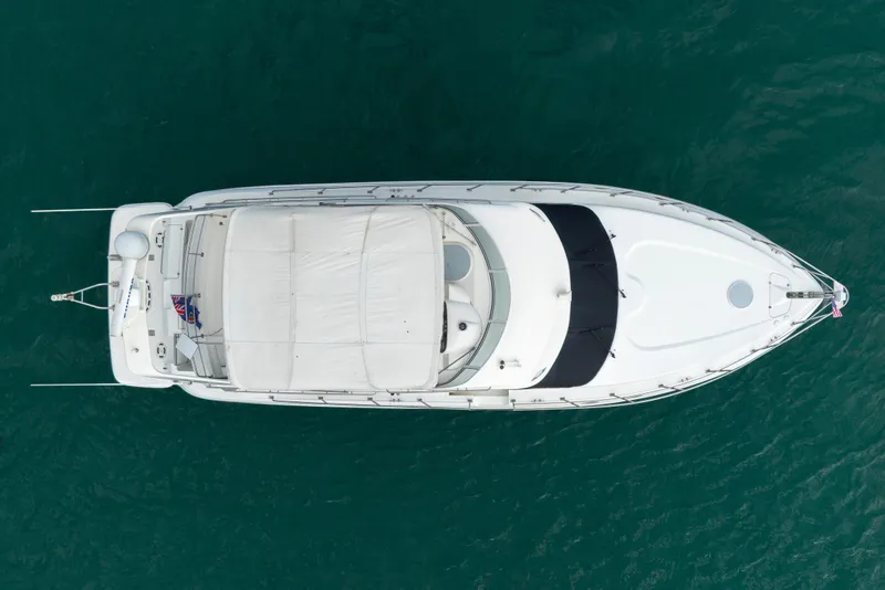 Slide: The Image of Aerial view of 2001 Cruisers Yachts 5000 Sedan Sport on blue water. - 19