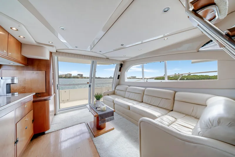 Slide: The Image of Luxurious interior of 2001 Cruisers Yachts 5000 Sedan Sport with panoramic windows and plush seating. - 41