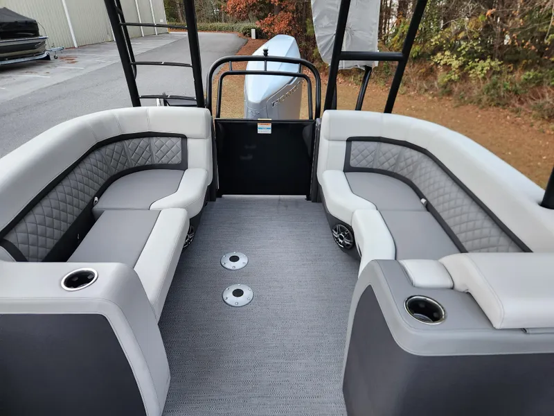 Slide: The Image of Interior of 2025 Godfrey AquaPatio Sundeck 275 SDC with luxurious seating and cup holders. - 10