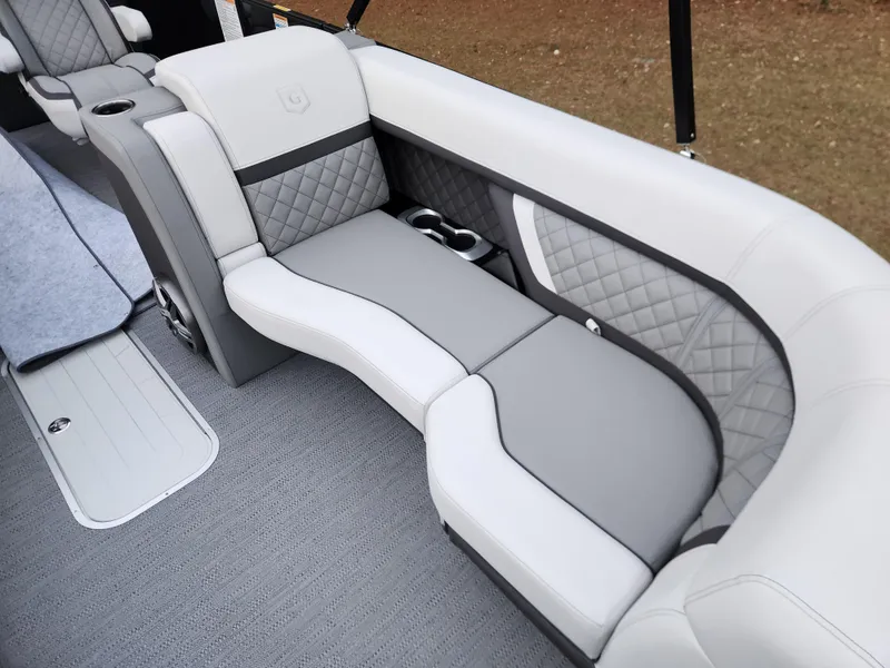 Slide: The Image of 2025 Godfrey AquaPatio Sundeck 275 SDC interior with luxurious gray seating and quilted accents. - 8