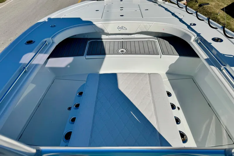 Slide: The Image of 2021 Costa Custom Boats 264 HC interior with seating and storage compartments. - 16