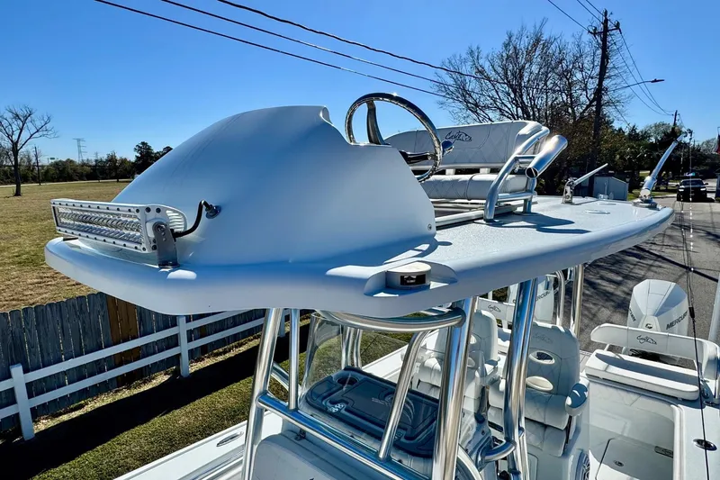 Slide: The Image of 2021 Costa Custom Boats 264 HC with elevated helm and seating, featuring sleek design. - 19