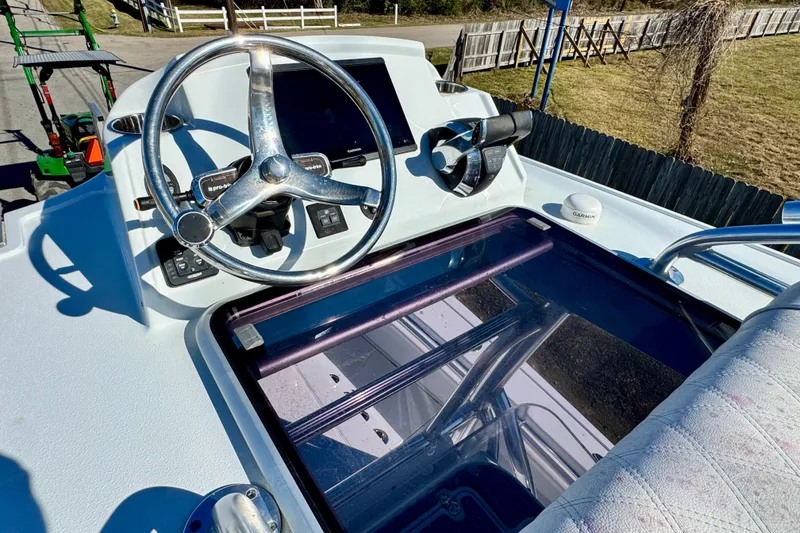Slide: The Image of Helm of 2021 Costa Custom Boats 264 HC with steering wheel and controls. - 20