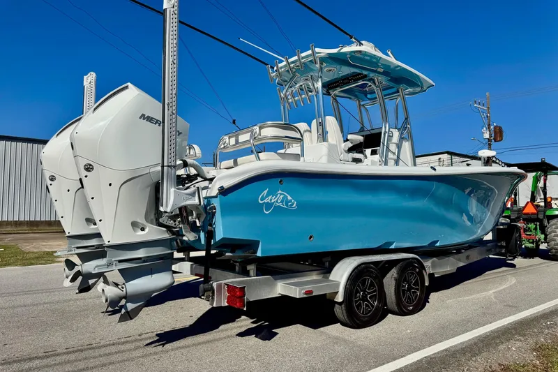 Slide: The Image of 2021 Costa Custom Boats 264 HC on trailer, featuring dual Mercury engines, blue hull. - 4