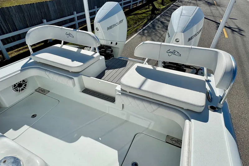 Slide: The Image of 2021 Costa Custom Boats 264 HC with dual Mercury engines and cushioned seating. - 7