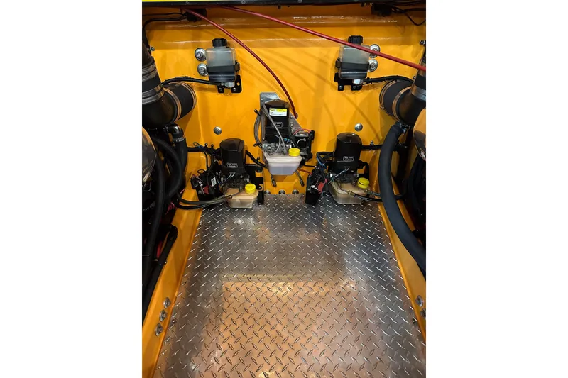 Slide: The Image of Engine compartment of a 2007 Eliminator Daytona 30 with diamond plate flooring. - 10