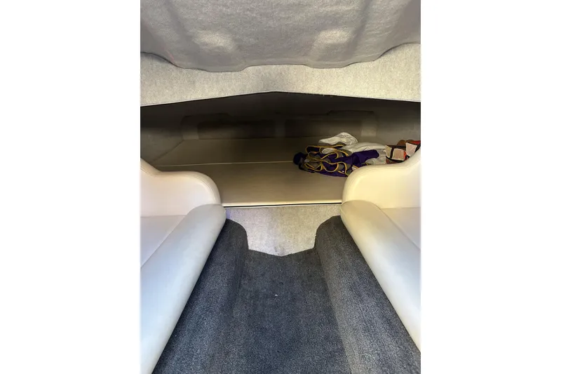 Slide: The Image of Interior cabin of 2007 Eliminator Daytona 30 boat with seating and storage area. - 23