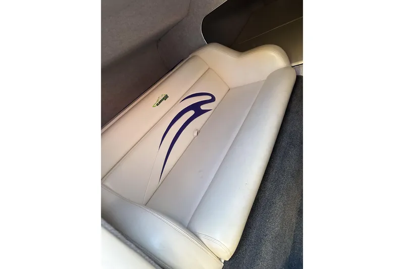 Slide: The Image of 2007 Eliminator Daytona 30 boat interior with white seating and blue design. - 25