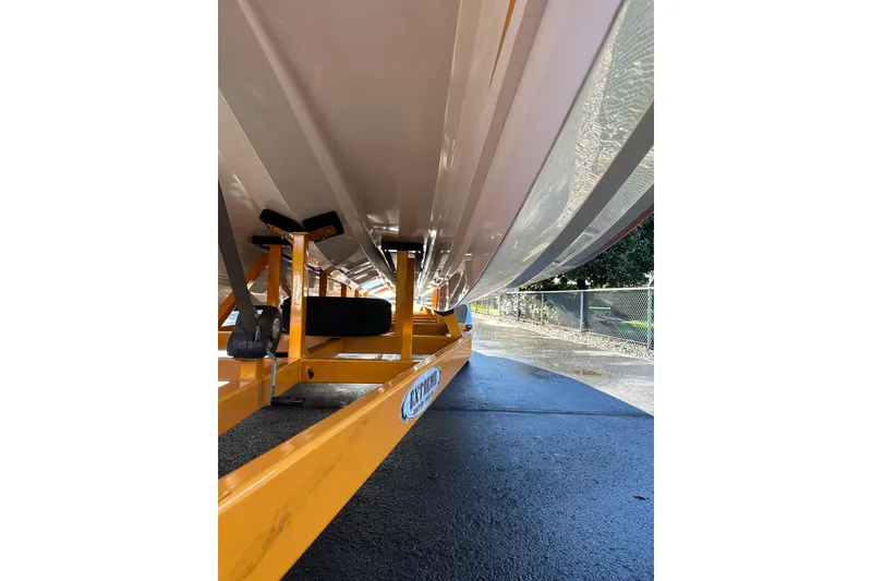 Slide: The Image of 2007 Eliminator Daytona 30 boat on yellow trailer, viewed from below. - 34